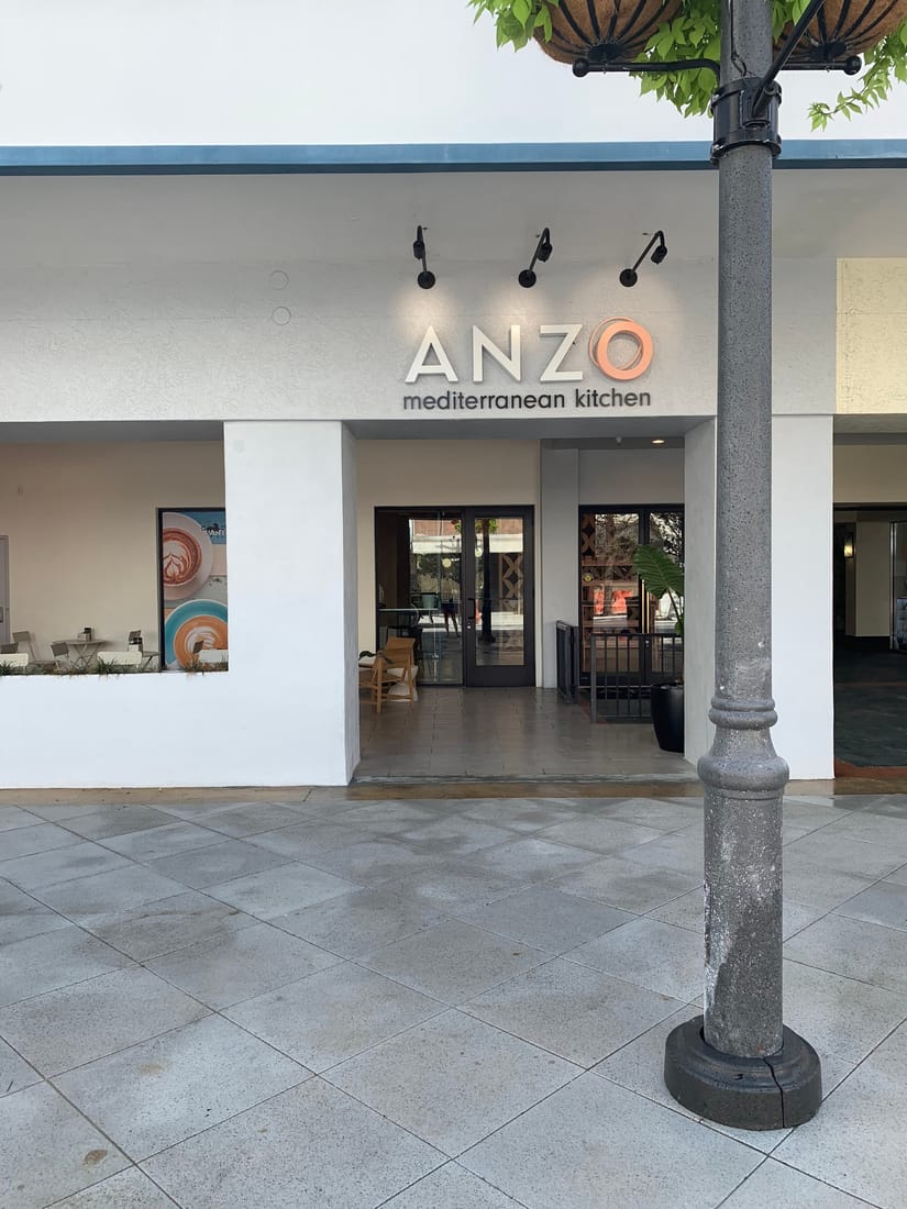 Dimensional exterior sign over a Mediterranean kitchen