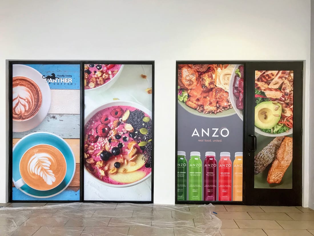 Full-color food photography window graphics on a restaurant