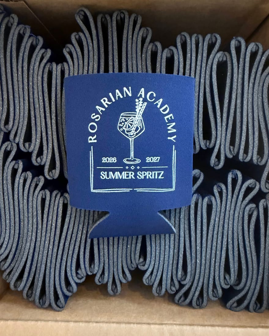 A screen-printed can cooler made for a school fundraiser